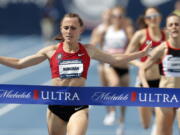 Shelby Houlihan celebrates as she wins the women’s 1500-meter run at the U.S. Championships athletics meet, Saturday, June 23, 2018, in Des Moines, Iowa.