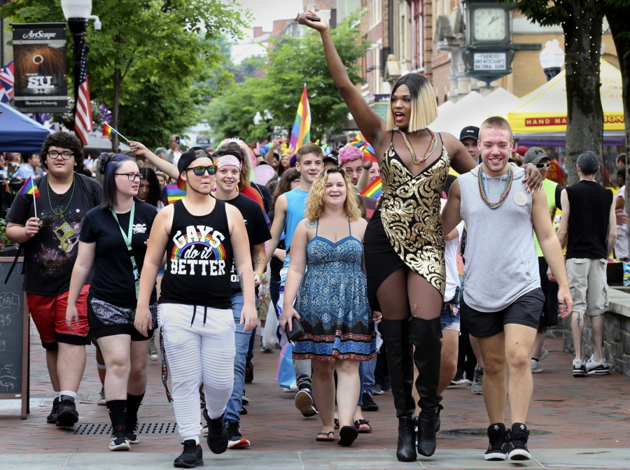 Drag Queen Alicia Wood of Washington, D.C. leads the pride parade down the Loudoun Street Pedestrian Mall in Winchester, Va., Saturday, June 23, 2018, during the city's first Pride Celebration in conjunction with the month of June being LGBT (lesbian, gay, bisexual, transgender) Pride Month.