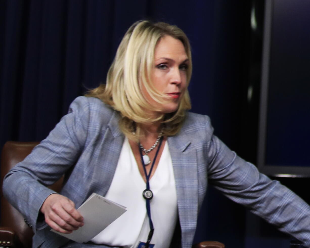 FILE - In this March 22, 2018, file photo, Kelly Sadler, special assistant to President Donald Trump, attends a forum at the Eisenhower Executive Office Building on the White House complex in Washington. Sadler, who was dismissive of gravely ill Sen. John McCain during a closed-door meeting last month, has left the White House.