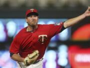 Minnesota Twins pitcher Zach Duke throws against the Tampa Bay Rays in a baseball game Friday, July 13, 2018, in Minneapolis.(AP Photo/Jim Mone)