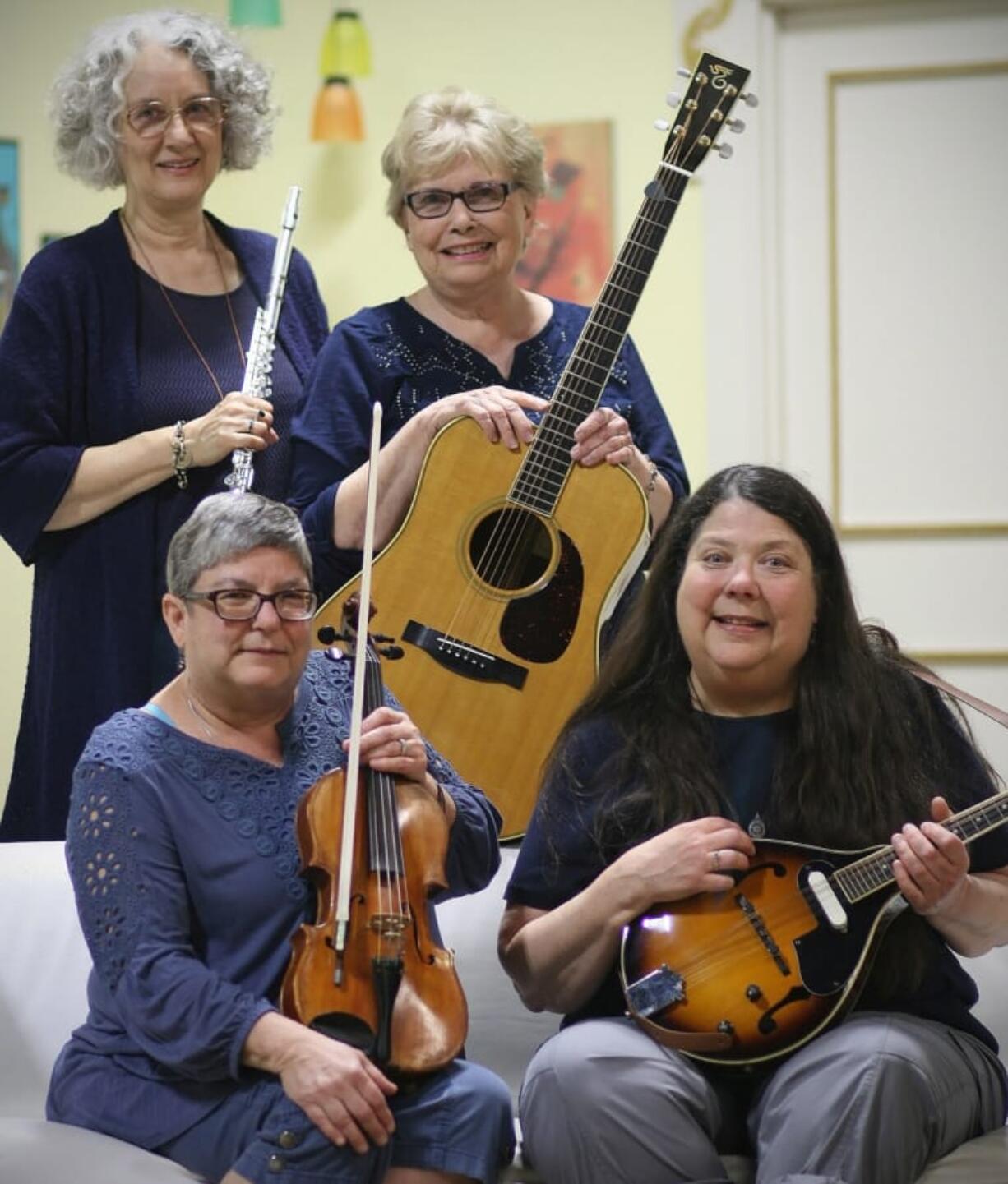 The Bluegrass Belles – Kathleen Sykora (back left), Hazel Peterson, Lori Watson (front left) and Michele Glover – will perform at the “Shine a Light on Magenta” fundraiser.