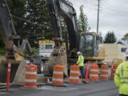 Workers from NW Natural respond after an excavator damaged a natural gas line on Northeast 78th Street in Hazel Dell causing a road closure Monday morning, July 2, 2018. No injuries were reported in the incident and traffic was routed around the scene.