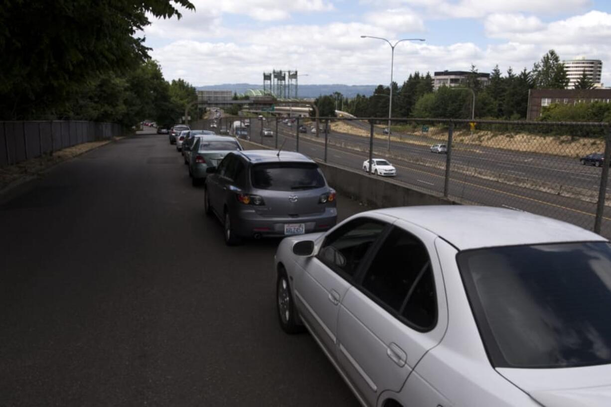 Parked cars line one side of Anderson Street in Vancouver, which had become clogged with people parking along the road instead of paying for parking downtown.