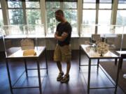 Andy Trapani of San Jose, Calif., views the Na Kanaka art installation Friday afternoon at the Fort Vancouver Visitor Center.