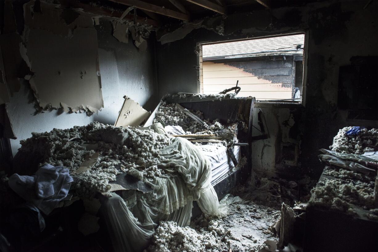 The bedroom of a resident is seen here following a fire at an apartment complex on Bridge Street in Rose Village, Monday morning, July 9, 2018.