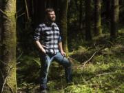 Hunter Decker, a forester with Clark County Public Works, poses for a press photo at Camp Bonneville. He spends some days out at Camp Bonneville and others working with the public and permitting issues.