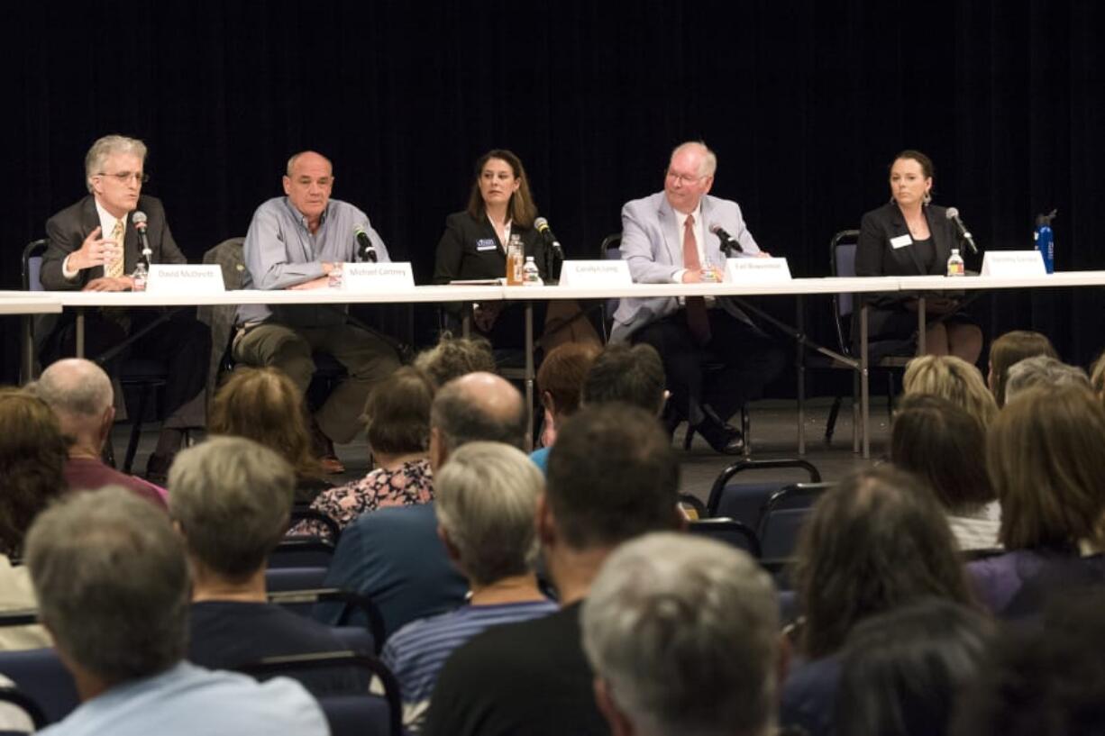 3rd Congressional District candidates, from left, David McDevitt, Michael Cortney, Carolyn Long, Earl Bowerman and Dorothy Gasque participated in the League of Women Voters’ first congressional forum Thursday evening. Candidates addressed topics including immigration, federal spending and campaign reform.