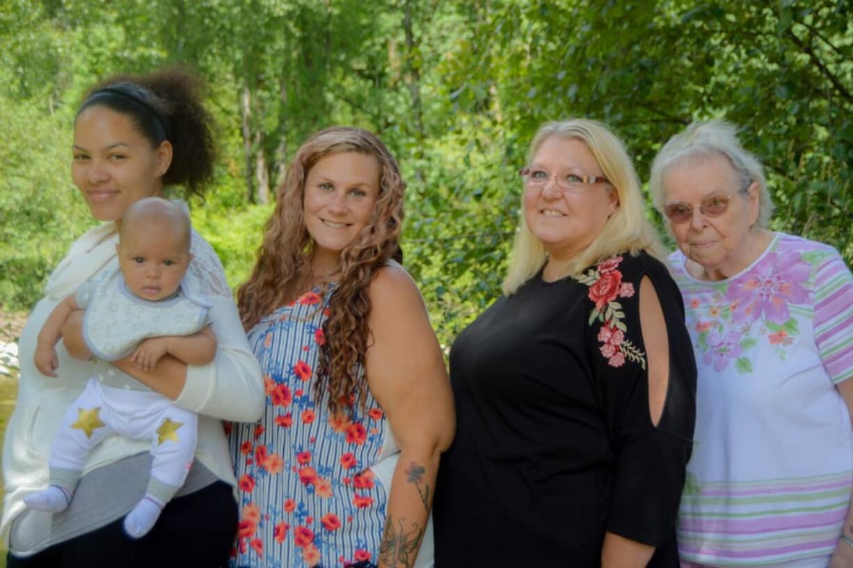 At left is Lyric Henifin, three months, held by his mother, Tourei Henifin, 24, both of Phoenix, Ariz., at Daybreak Park, Battle Ground, in July. Also pictured, from right, are his great-great-grandmother, Sylvia Henifin, 88, of Vancouver; great-grandmother, Victoria Henifin, 61, of Vancouver; and grandmother, Chanell Henifin, 39, of Phoenix.