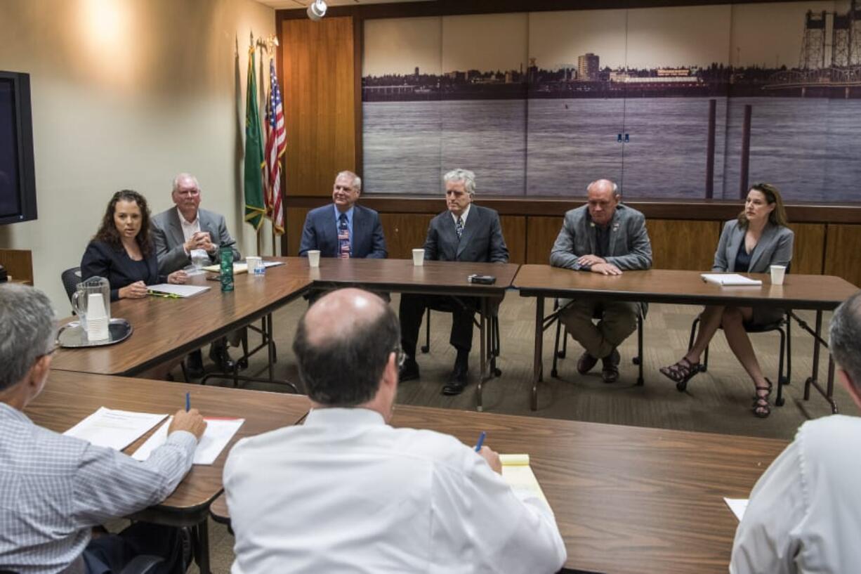 Third Congressional District candidates, from left, Dorothy Gasque, Earl Bowerman, Martin Hash, David McDevitt, Michael Cortney, and Carolyn Long meet with The Columbian’s Editorial Board in Vancouver on Wednesday.