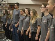 Members of the Battle Ground High School vocal jazz ensemble practice the classic 1980s power ballad “I Want To Know What Love Is” on Thursday in preparation for their Saturday performance with Foreigner.