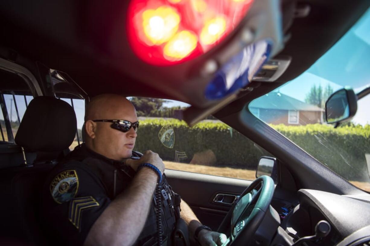 Woodland Police Sgt. Jim Keller makes a traffic stop on Friday. Rumors have spread recently that city officials are looking at disbanding the department to contract out with Cowlitz County Sheriff’s Department, but Woodland officials say they’re just looking at all their options for police service and that there’s no plan on getting rid of the city’s police force.