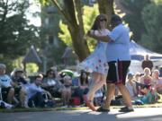 Pamela Gandarillas dances with Ralph Stevens as they enjoy the Vancouver Symphony Orchestra in Esther Short Park in downtown Vancouver on Thursday.