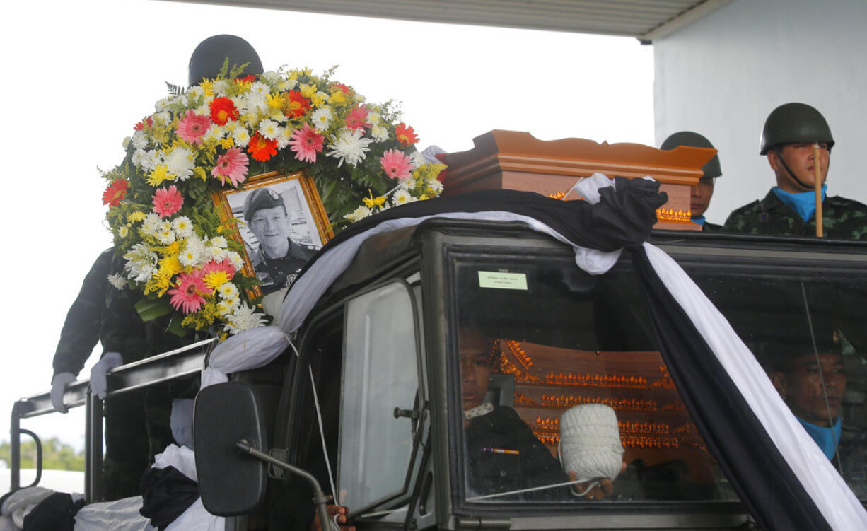 The body of Saman Gunan, a former Thai navy SEAL who died during an overnight mission, is carried during a repatriation and religious rites ceremony at Chiang Rai Airport in Mae Sai, Chiang Rai province, in northern Thailand Friday, July 6, 2018. The Thai navy diver working as part of the effort to rescue 12 boys and their soccer coach trapped in a flooded cave died Friday from lack of oxygen, underscoring risks of extracting the team.