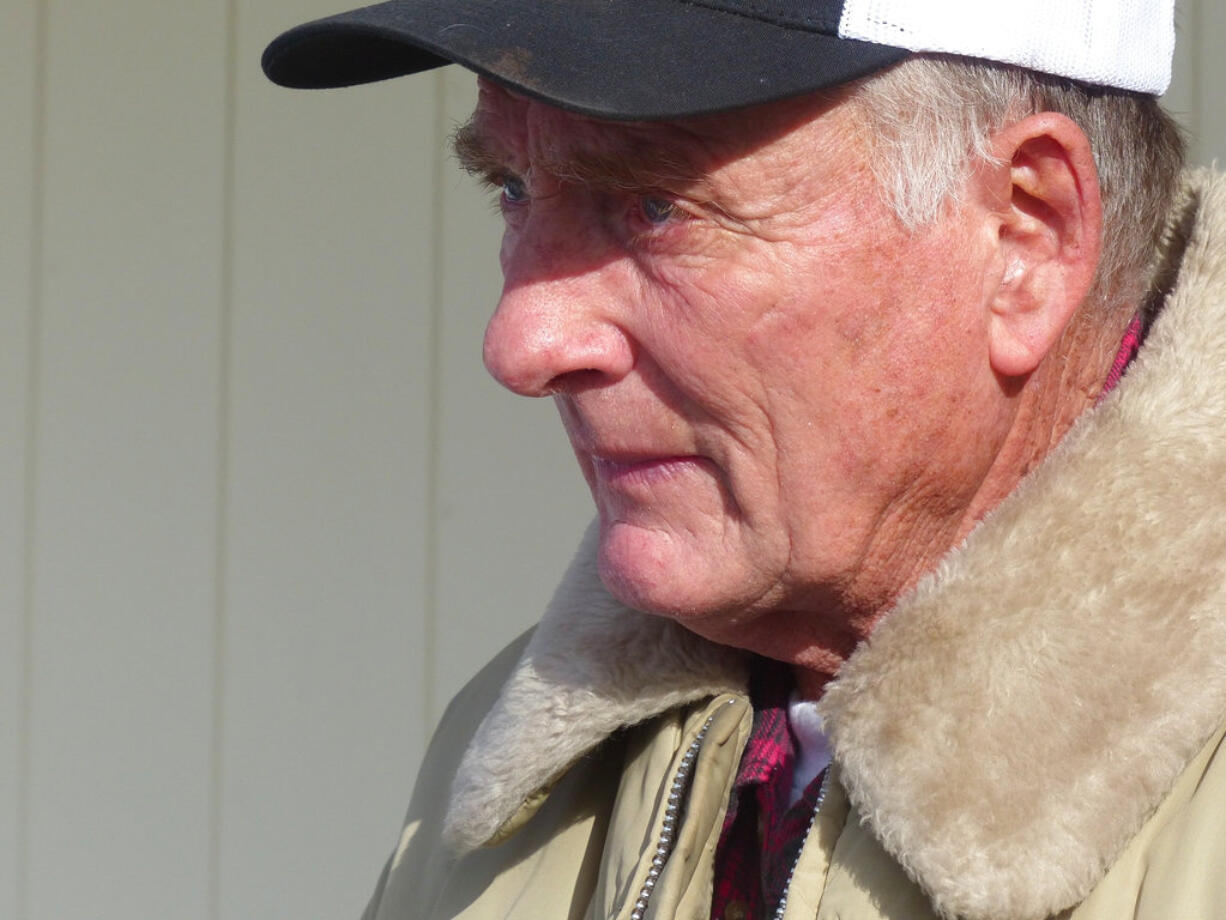 FILE - In this Jan. 2, 2016, file photo, rancher Dwight Hammond Jr. greets protesters outside his home in Burns, Ore. President Donald Trump has pardoned Dwight and Steven Hammond, two ranchers whose case sparked the armed occupation of a national wildlife refuge in Oregon. The Hammonds were convicted in 2012 of intentionally and maliciously setting fires on public lands.