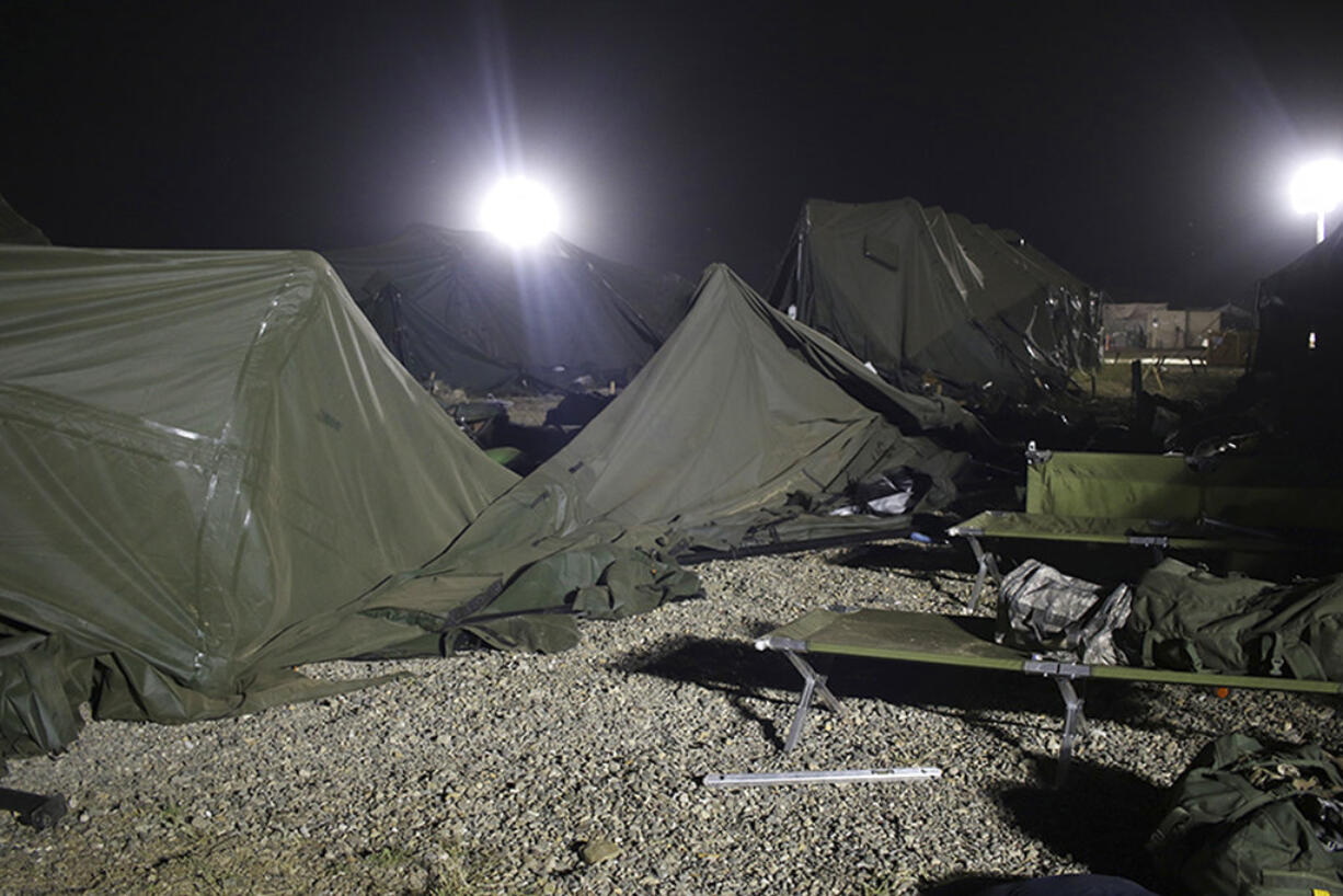 This photo provided by the U.S. Army shows a tent that was blown down by a helicopter injuring 22 people at the Fort Hunter Liggett military base in California on Wednesday, July 18, 2018. A U.S. Army UH-60 Blackhawk helicopter was landing about 9:30 p.m. when the wind from its rotor caused the tent to collapse, said Amy Phillips, public information officer at the Monterey County base. (Spc. Derek Cummings/U.S.