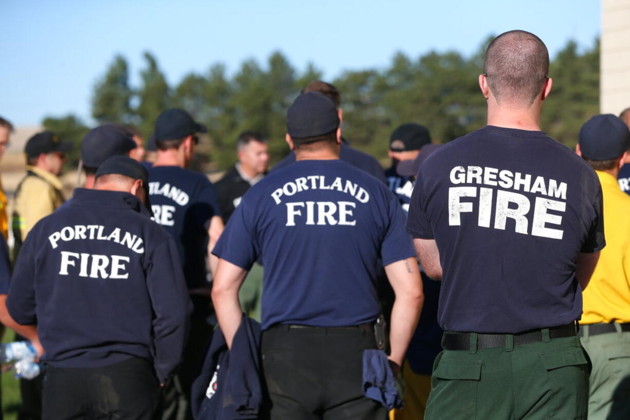 The central command center for the Substation fire gathers at Sherman County School in Moro, Ore., Thursday, July 19, 2018.