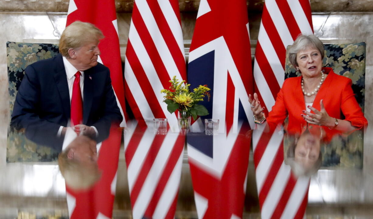 U.S. President Donald Trump, left, with British Prime Minister Theresa May, right, during their meeting at Chequers, in Buckinghamshire, England, Friday, July 13, 2018.