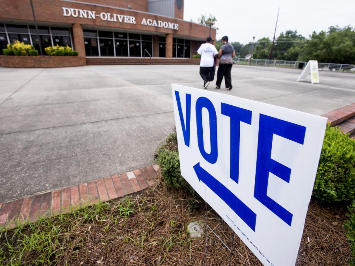 Voters make their way into the polling station Tuesday on the Alabama State University campus in Montgomery, Ala., to vote in a runoff election for a U.S. House of Representatives seat.