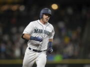 Seattle Mariners’ Chris Herrmann runs the bases after hitting a solo home run off Los Angeles Angels relief pitcher Miguel Almonte during the seventh inning of a baseball game Thursday, July 5, 2018, in Seattle.