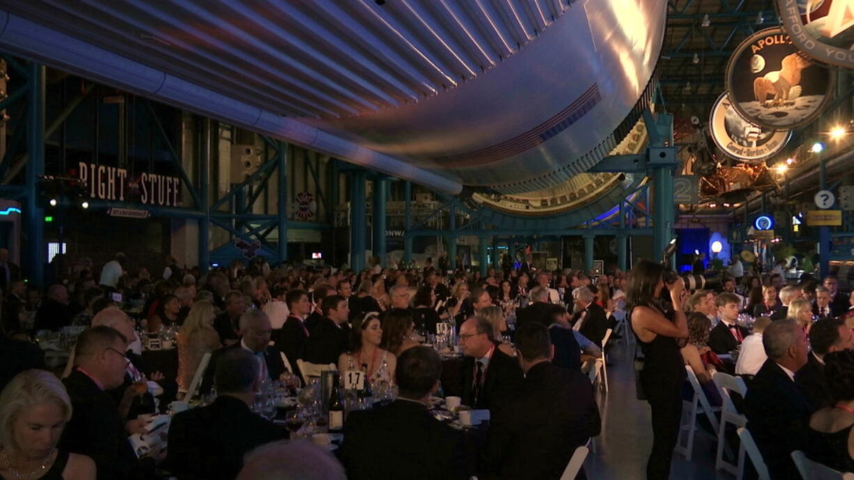 The black-tie Apollo Celebration Gala is held under a Saturn V rocket at the Kennedy Space Center in Cape Canaveral, Fla., on Saturday. The event kicked off a yearlong celebration of the upcoming 50-year anniversary of the first moon landing, and featured a panel discussion by astronauts, an awards ceremony and an auction of space memorabilia.