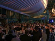 The black-tie Apollo Celebration Gala is held under a Saturn V rocket at the Kennedy Space Center in Cape Canaveral, Fla., on Saturday. The event kicked off a yearlong celebration of the upcoming 50-year anniversary of the first moon landing, and featured a panel discussion by astronauts, an awards ceremony and an auction of space memorabilia.