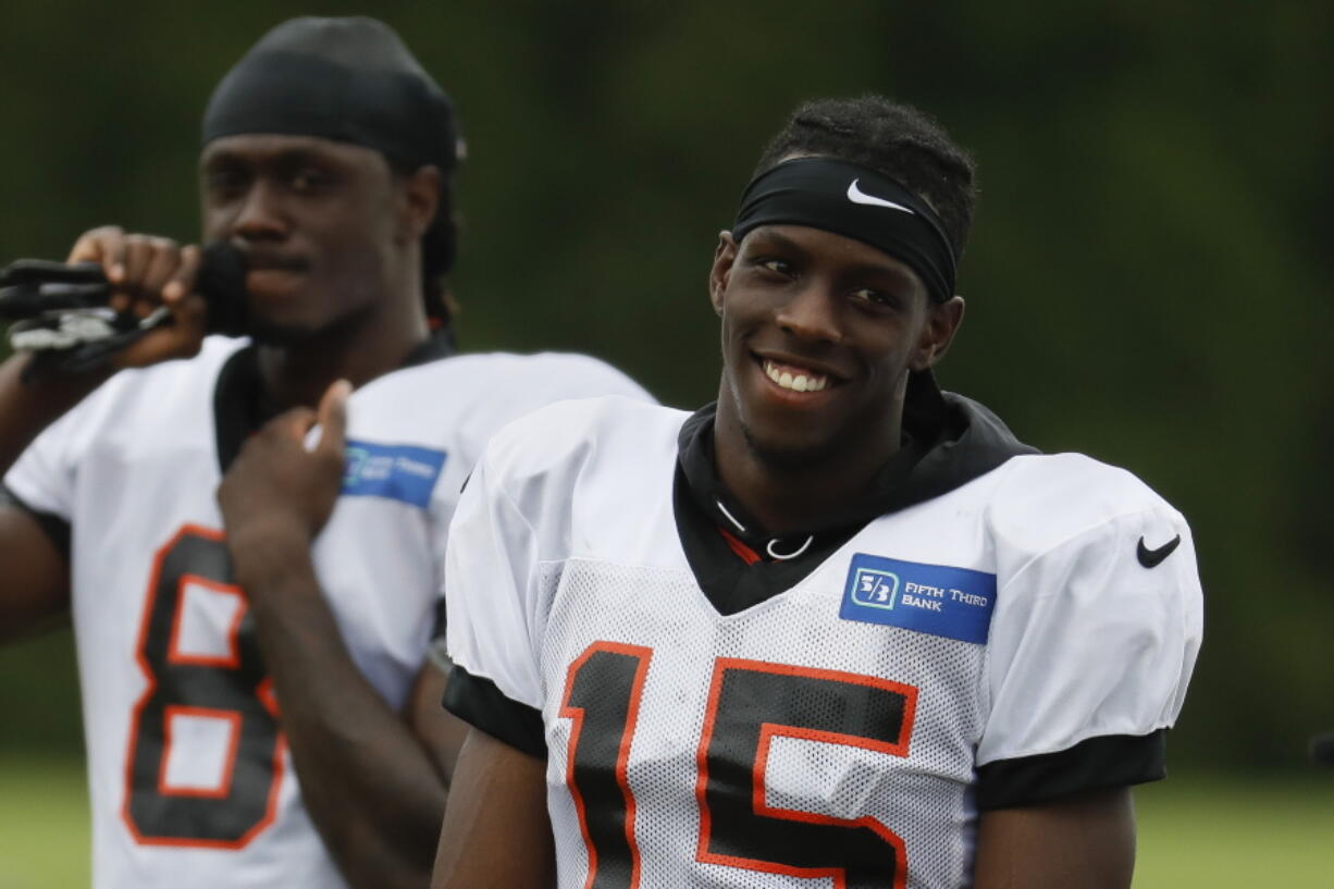 Cincinnati Bengals wide receiver John Ross smiles on the field during NFL football practice, Monday, July 30, 2018, in Cincinnati.