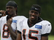 Cincinnati Bengals wide receiver John Ross smiles on the field during NFL football practice, Monday, July 30, 2018, in Cincinnati.