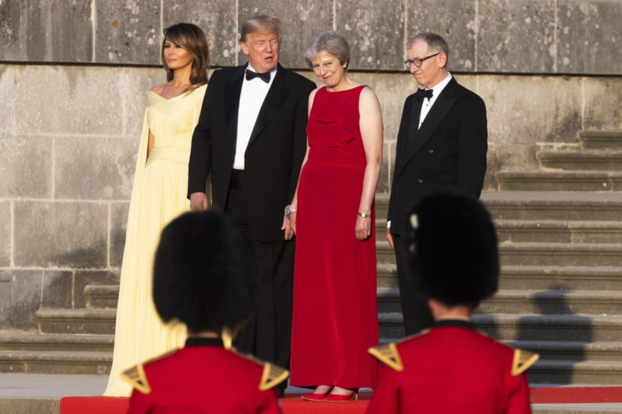 From left, first lady Melania Trump, President Donald Trump, British Prime Minister Theresa May, and her husband Philip May, watch the arrival ceremony at Blenheim Palace, in Blenheim west of London, England, Thursday, July 12, 2018.