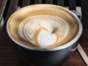 This Thursday, March 29, 2018 photo shows a cup of coffee at a cafe in Los Angeles. A 10-year study released on Monday, July 2, 2018 shows that coffee drinkers had a lower risk of death than abstainers, including those who downed at least eight cups daily. The benefit was seen with instant, ground, decaf, and in people with genetic glitches affecting how their bodies use caffeine.