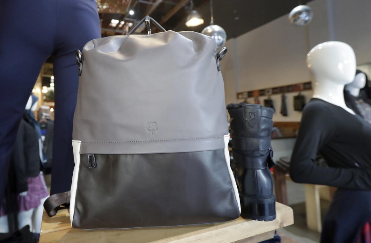 In this Feb. 15, 2018 photo, a handbag designed by Tiffany Tam is displayed on a shelf at a Betabrand store in San Francisco. Betabrand represents one of the most dramatic examples of how companies _ big and small _ are starting to use digital technology to reinvent and speed upÂ the process of designing and selling clothing to shoppers in the age of Amazon.