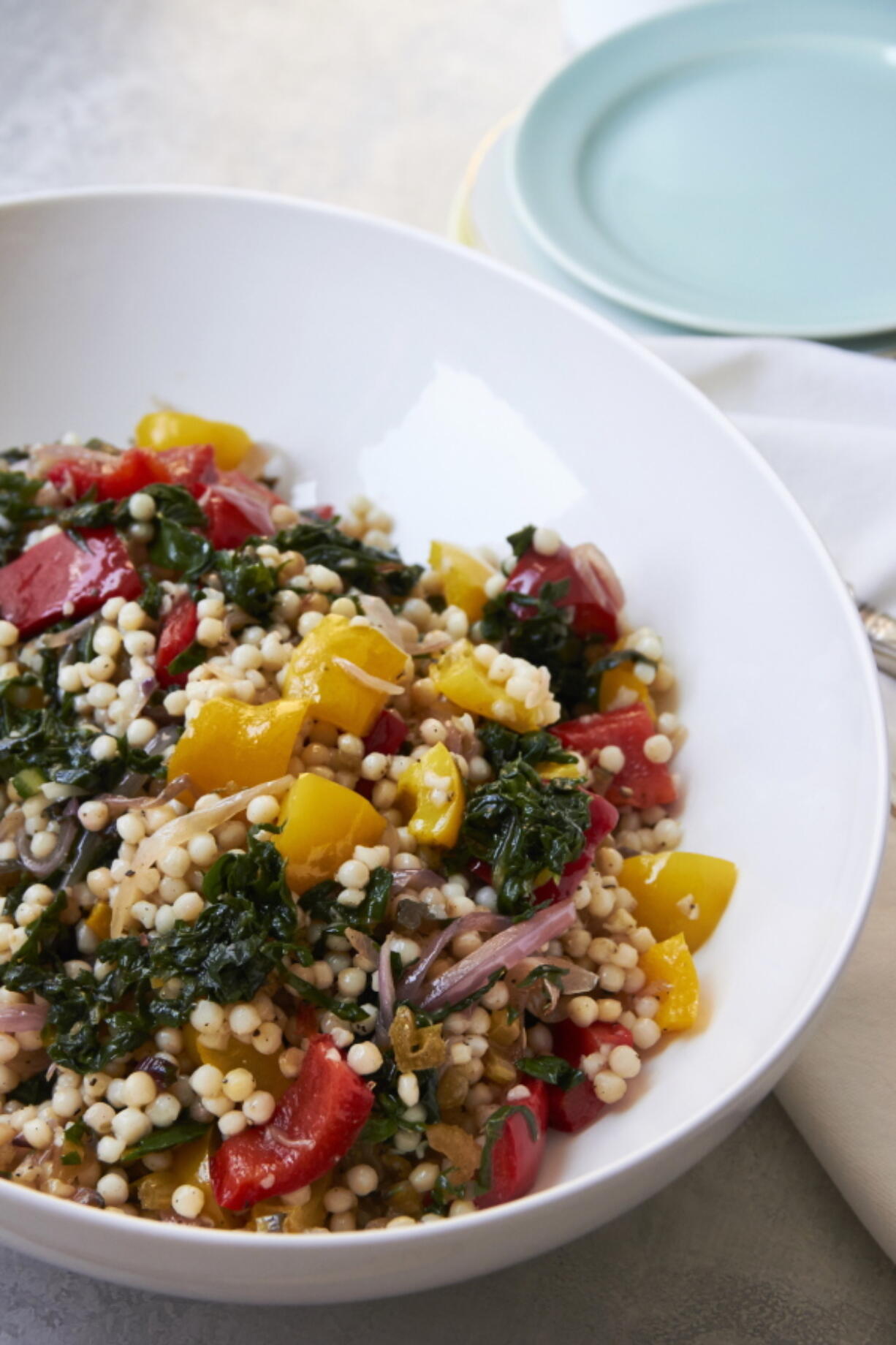 This September 2018 photo shows Israeli couscous in New York. Israeli or Mediterranean couscous are tiny balls of toasted semolina pasta that plump up when cooked into toothsome, chewy, slightly less tiny balls of pasta.