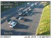 Traffic backing up on Interstate 5 at 29th Street in Vancouver. A man in Portland is threatening to jump off a bridge near the Interstate 84 interchange.