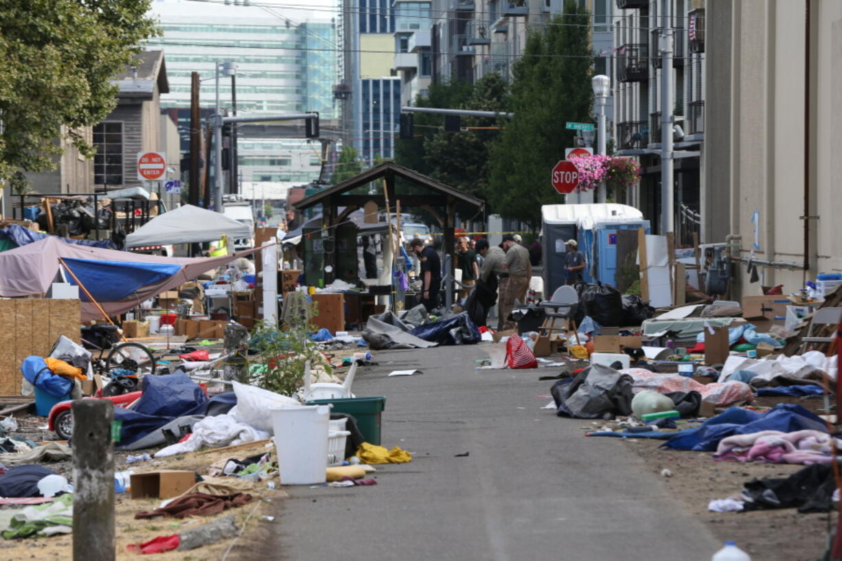 Authorities clear the protest encampment at the Southwest Portland offices of the Federal Immigration and Customs Enforcement agency in July 2018 in Portland.