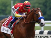 Justify, with jockey Mike Smith up, crosses the finish line to win the 150th running of the Belmont Stakes. The undefeated Triple Crown winner has been retired from racing because of fluid in his left front ankle, trainer Bob Baffert and Justify’s owners announced Wednesday, July 25, 2018.