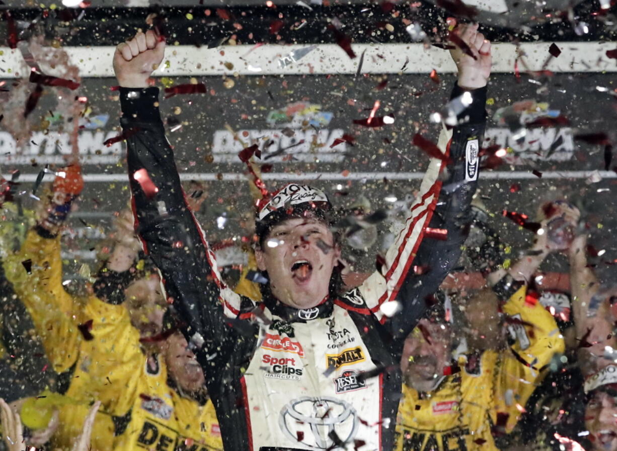 Erik Jones celebrates after winning the NASCAR Cup Series auto race at Daytona International Speedway.