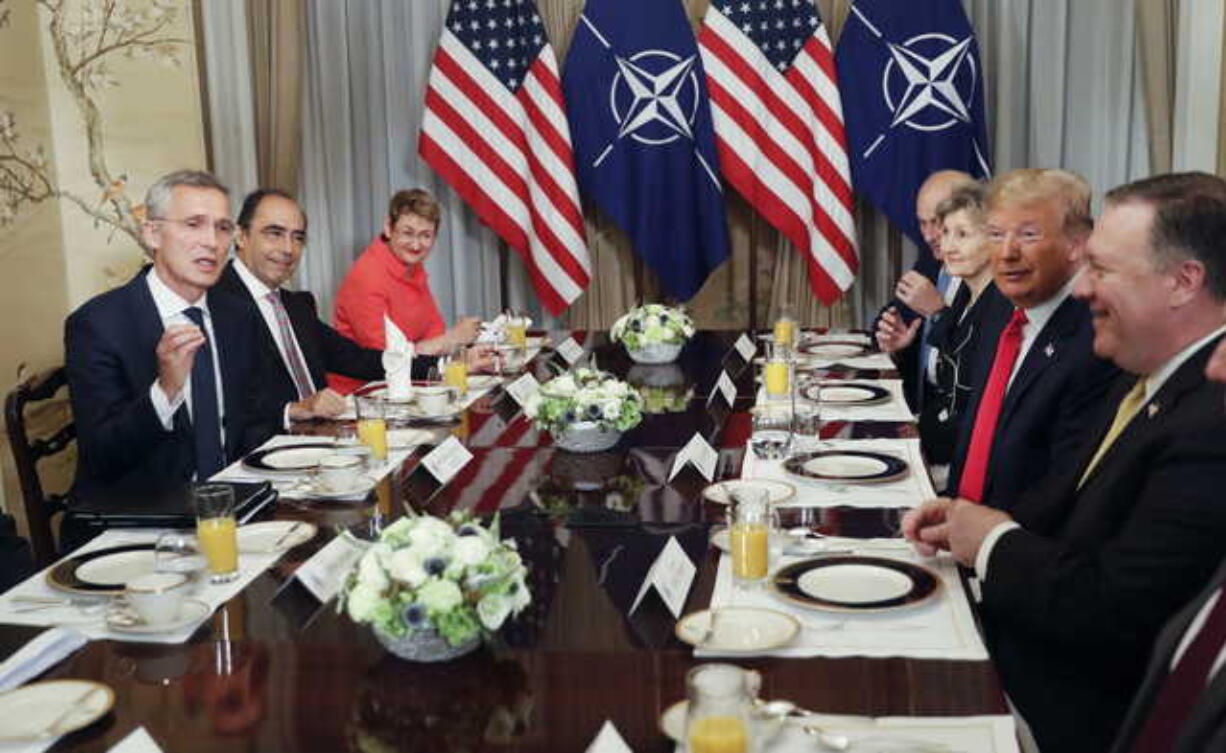 U.S. President Donald Trump, second right, listens to NATO Secretary General Jens Stoltenberg, left, during their bilateral breakfast, Wednesday July 11, 2018 in Brussels, Belgium.