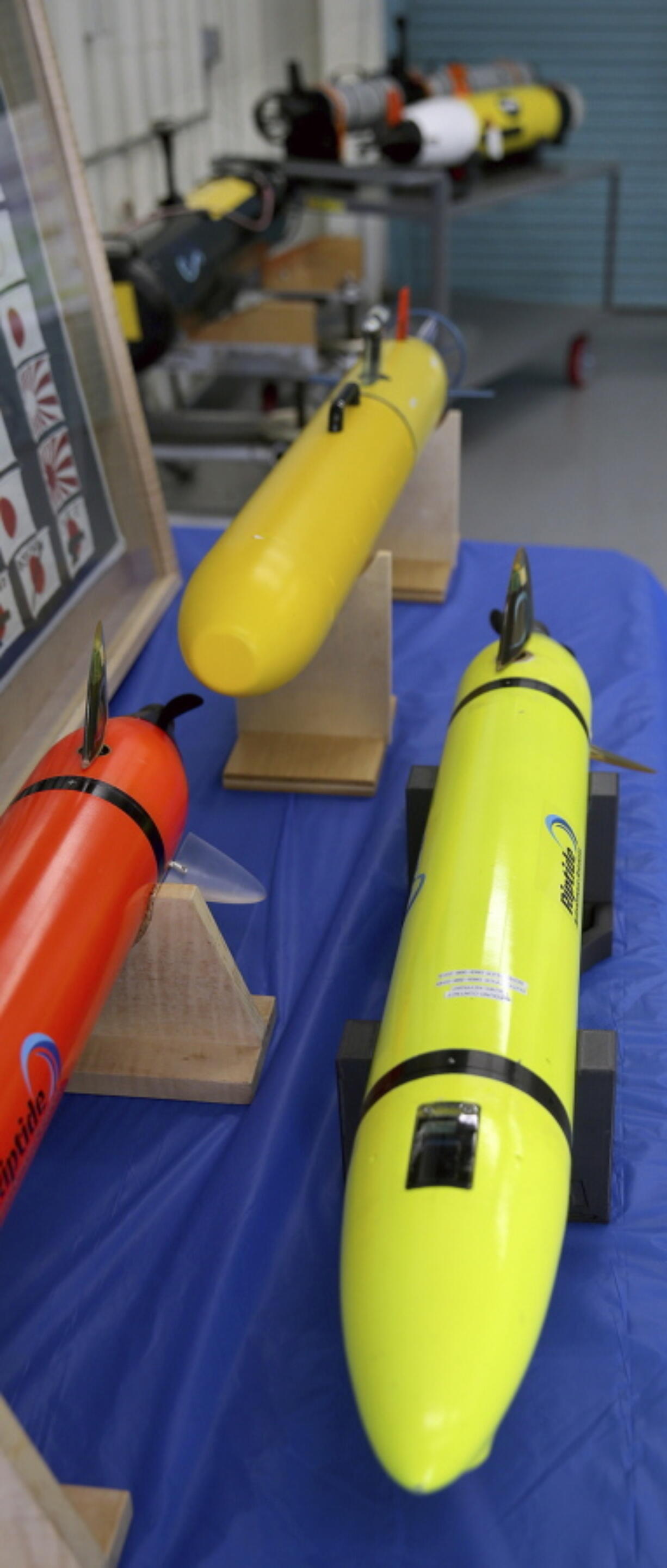 Small U.S. Navy unmanned undersea drones are displayed June 28 at Naval Base Kitsap in Bremerton.