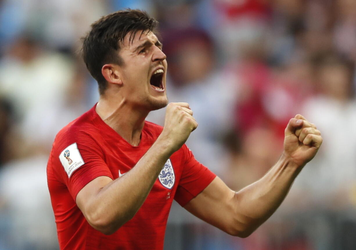 England’s Harry Maguire celebrates victory of his team over Sweden during the quarterfinal match between Sweden and England at the 2018 soccer World Cup in the Samara Arena, in Samara, Russia, Saturday, July 7, 2018.