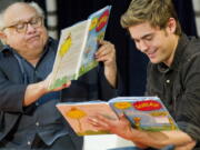 Stars Danny DeVito, left, and Zac Efron read “The Lorax” by Dr. Seuss to school children during the annual Read Across America Day at The New York Public Library in New York. Researchers at Dartmouth College, the alma mater of author and illustrator Theodore Geisel, better known as Dr. Seuss, said on Monday, July 23, 2018, that the furry orange protagonist of “The Lorax” and the Truffula trees may have been based on the patas monkey species and the whistling thorn acacia tree, both found in Kenya.