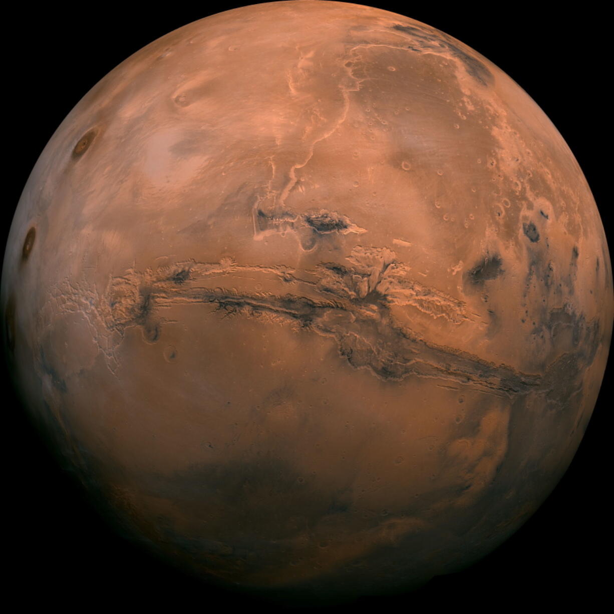 This image made available by NASA shows the planet Mars. This composite photo was created from over 100 images of Mars taken by Viking Orbiters in the 1970s. On Tuesday, July 31, the red planet will make its closest approach to Earth in 15 years.