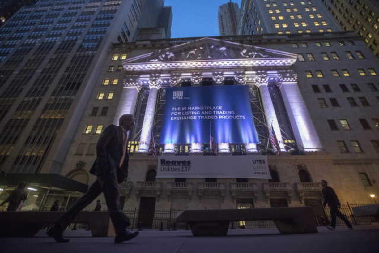 In this Oct. 25, 2016, file photo, a pedestrian walks past the New York Stock Exchange. The U.S. stock market opens at 9:30 a.m. EDT on Wednesday, July 11, 2018.