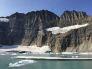 This Sept. 5, 2017 photo shows Grinnell Glacier at the turnaround point of an 11-mile round-trip hike in Glacier National Park in Montana. According to the National Park Service, the park’s glacial ice sheets are a fraction of the size they were 100 years ago, and they are melting so fast they will all be gone by 2030. (AP Photo/Beth J.