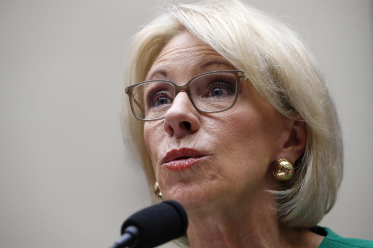 Education Secretary Betsy DeVos testifies at a House Committee on Education and the Workforce, n Capitol Hill in Washington. The Trump administration is rescinding Obama-era guidance that encouraged schools to take a person’s race into account to encourage diversity in admissions. That’s according to an administration official who spoke on condition of anonymity.