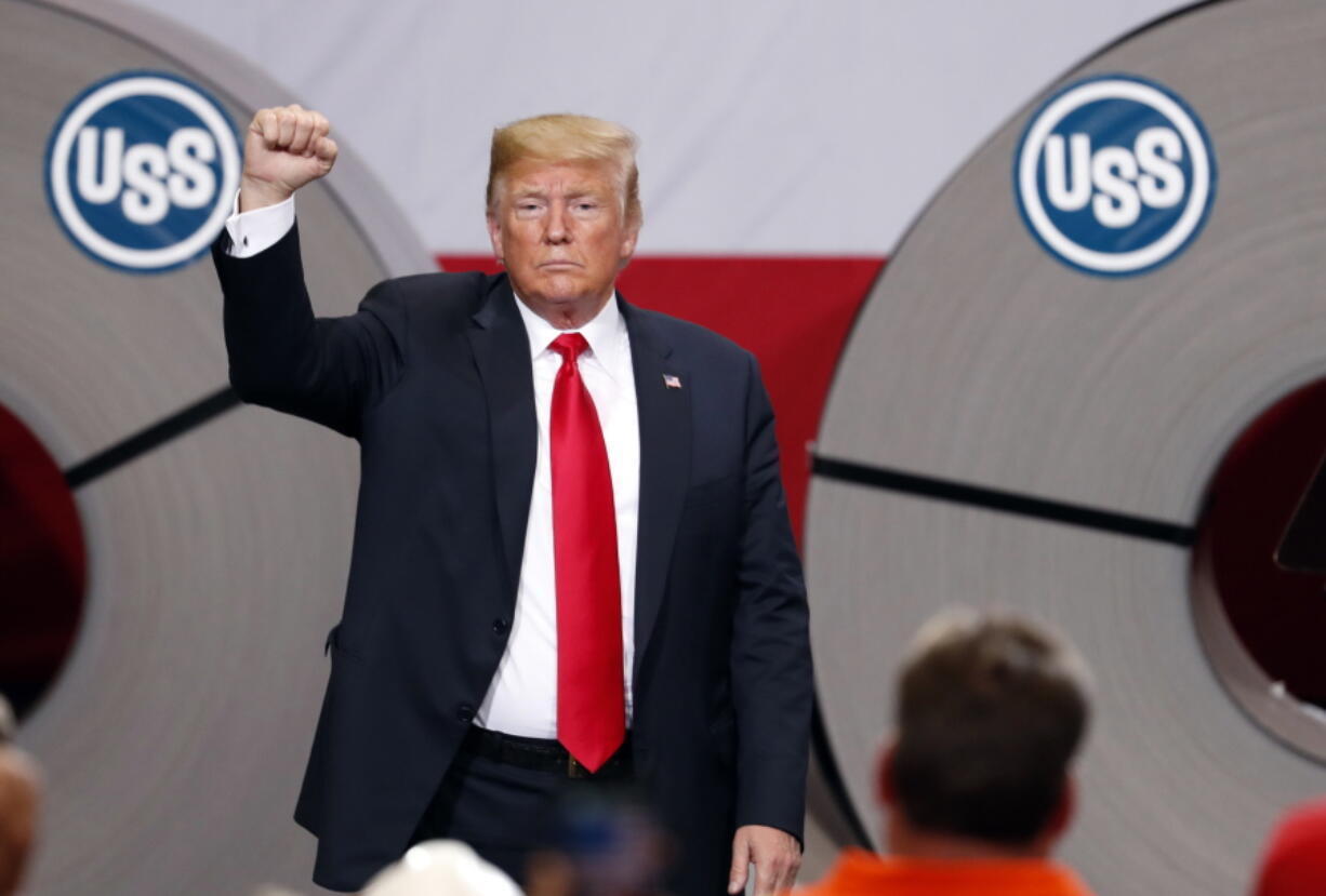 In this July 26, 2018, photo, President Donald Trump acknowledges the audience after speaking at the United States Steel Granite City Works plant in Granite City, Ill. Trump's trade policies are turning long-established Republican orthodoxy on its head. There are tariff fights, and there’s now $12 billion in farm aid that represents the type of government intervention GOP voters railed against a decade ago.