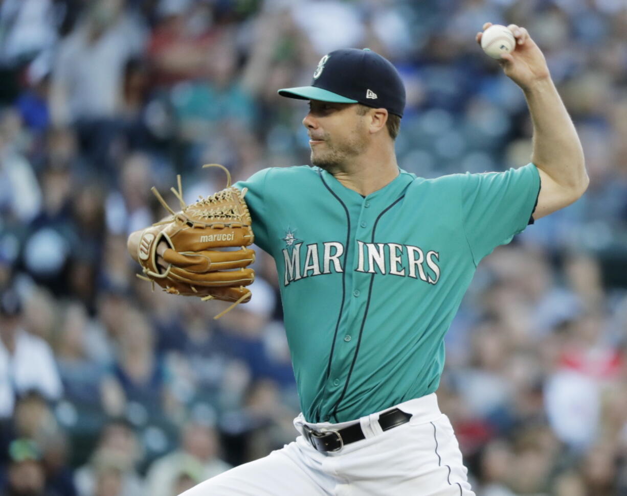 Seattle Mariners starting pitcher Wade LeBlanc throws to a Chicago White Sox batter during the first inning of a baseball game Friday, July 20, 2018, in Seattle. (AP Photo/Ted S.