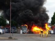 Several trucks burn early Saturday morning at a light industrial park on Southeast Columbia Way in Vancouver.