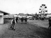 Fair manager Chat Knight walks in Bagley Park during the 1912 Clark County Fair there.