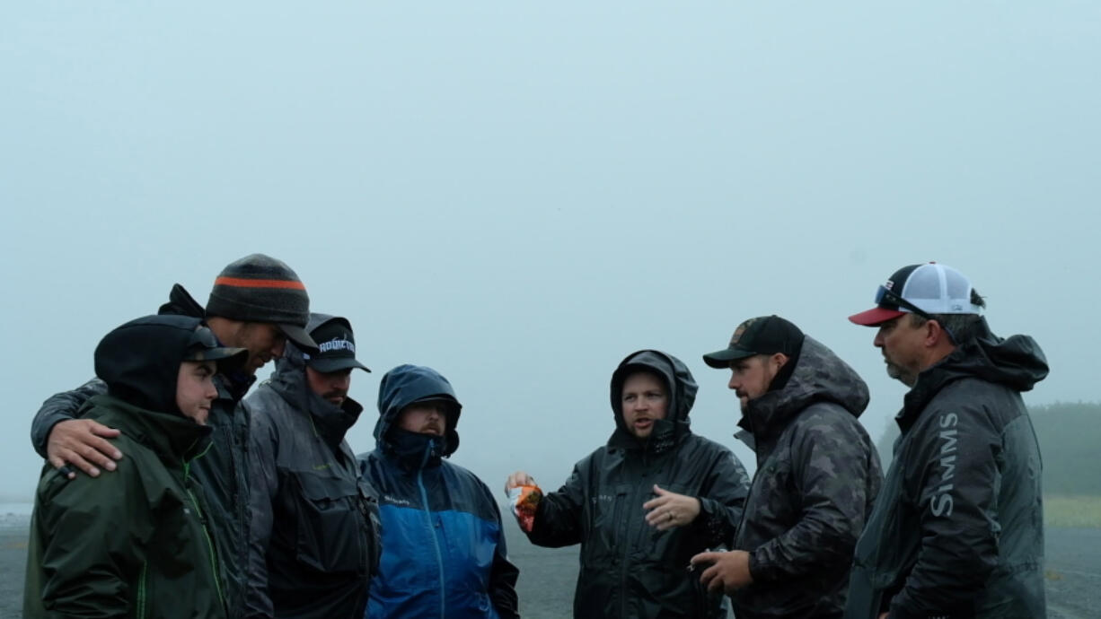 Marlin Lefever (center) discusses strategy with members of the Addicted team in Alaska. Addicted will soon post their Alaskan fishing movie online in six segments.