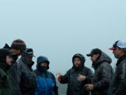 Marlin Lefever (center) discusses strategy with members of the Addicted team in Alaska. Addicted will soon post their Alaskan fishing movie online in six segments.