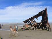 The bare bones of the Peter Iredale, a British four-masted bark that ran aground in 1906, are a magnet for beach visitors to Fort Stevens State Park, Ore.